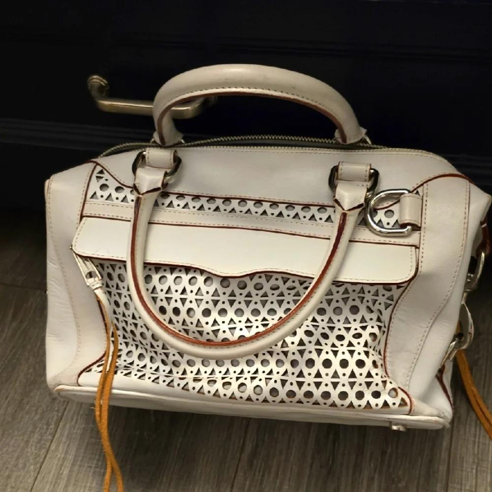 Rebeca Mincoff White Handbag with Cutout Design.